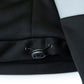 Black fabric detail with snap fastener on UHV773 HiVis Microfleece Soft Shell Jacket