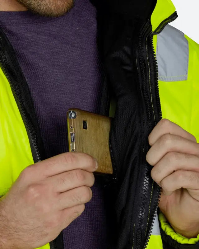 Wooden phone case with grain texture beside UHV821 HiVis Arctic 3-in-1 Jacket