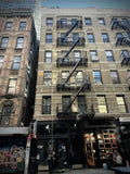 Urban building with fire escape and firefighting equipment for personal carry and fireground applications