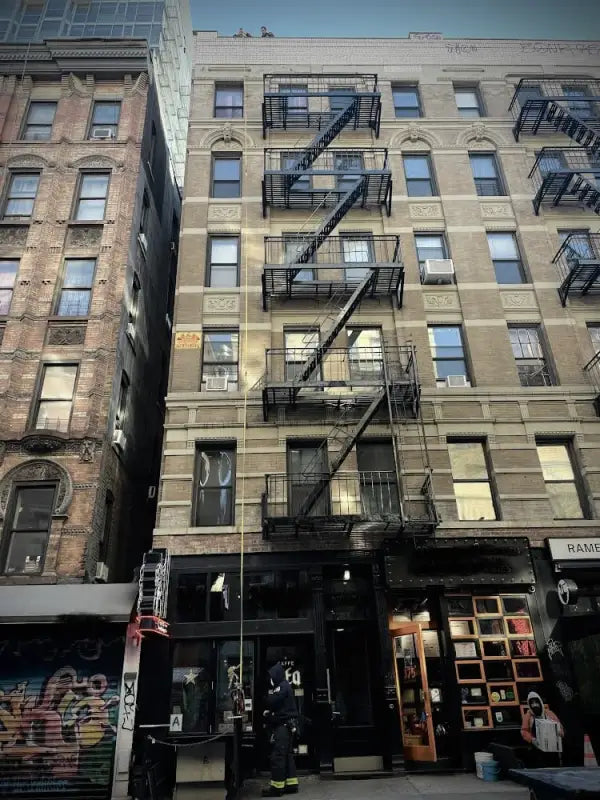 Urban building with fire escape and firefighting equipment for personal carry and fireground applications