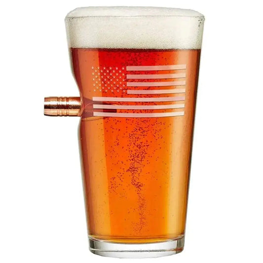 Flag pint glass with bullet detail, filled with amber beer and foam topping