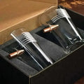 Two black and silver microphones with American flag designs beside a flag pint glass