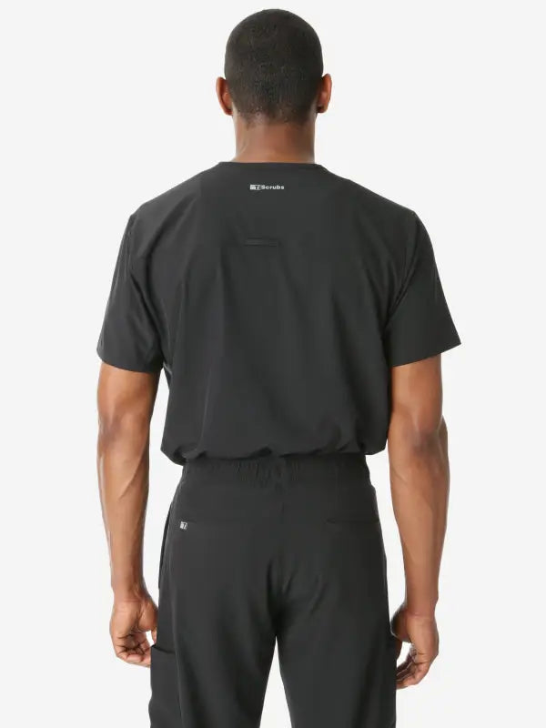 Back view of Men’s Double-Pocket Scrub Top in black, showcasing its stylish design