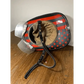 Vintage motorcycle helmet with red and black star pattern and smooth leather chin strap