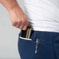 Wallet being removed from blue pants pocket of Carrier Joggers Mk.II with patented carrier retention