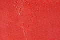 Water droplets on a red surface of the Line2Design Deluxe Step-In Firefighter Gear Bag