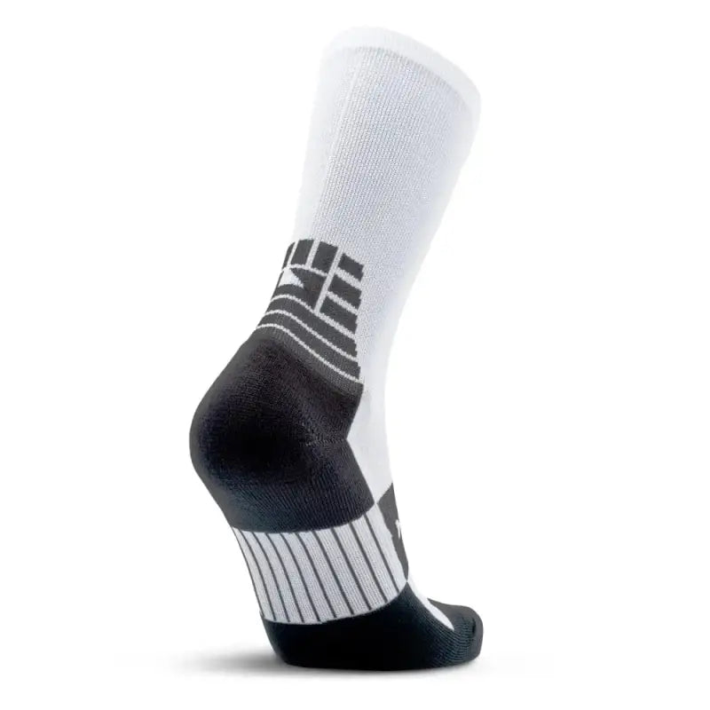 White MudGear Crew Height Socks featuring black and gray geometric designs