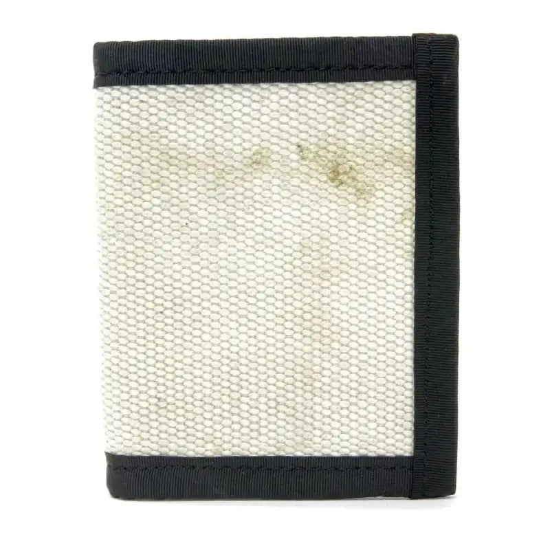 White canvas wallet with black trim edges in Coyote Combat Leather for stylish durability