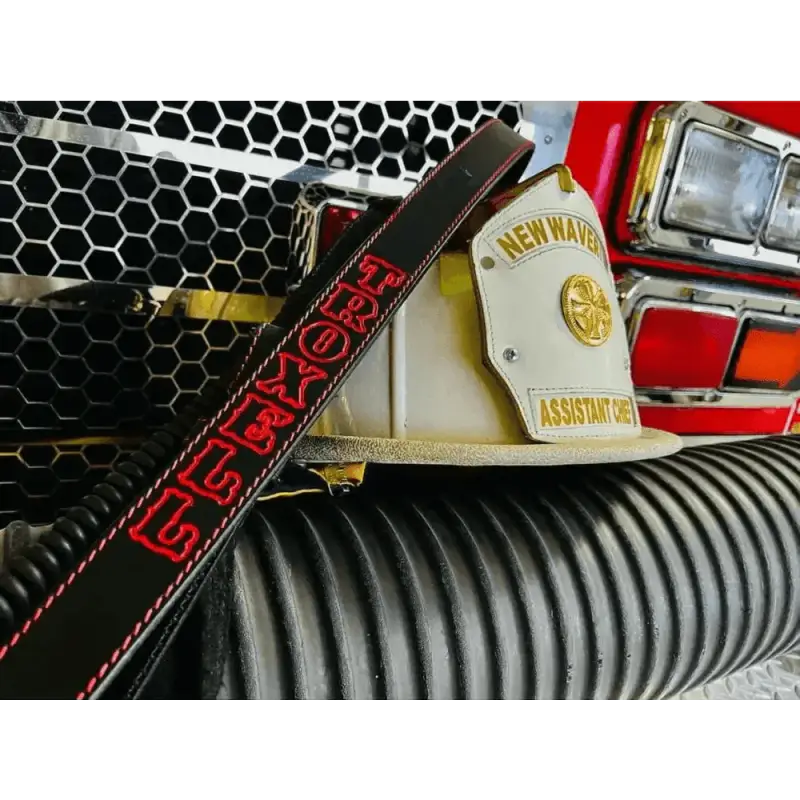 White fire chief helmet with gold badge and NEWMAN text on a Leather Radio Strap