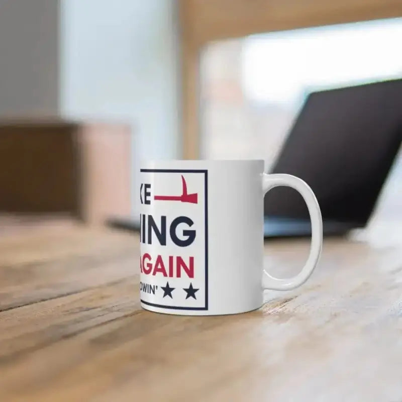 White coffee mug featuring Make Training Great campaign-style text and graphics