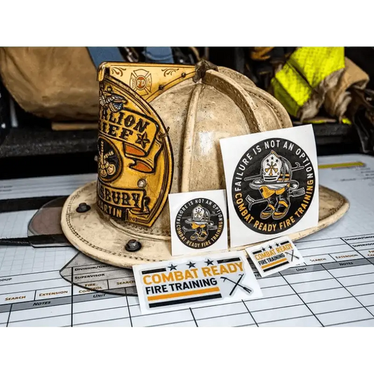 White firefighter helmet with stickers and patches beside training materials in Sticker Pack