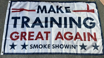 White flag with blue and red text Make Training Great Again and decorative stars in training great flag