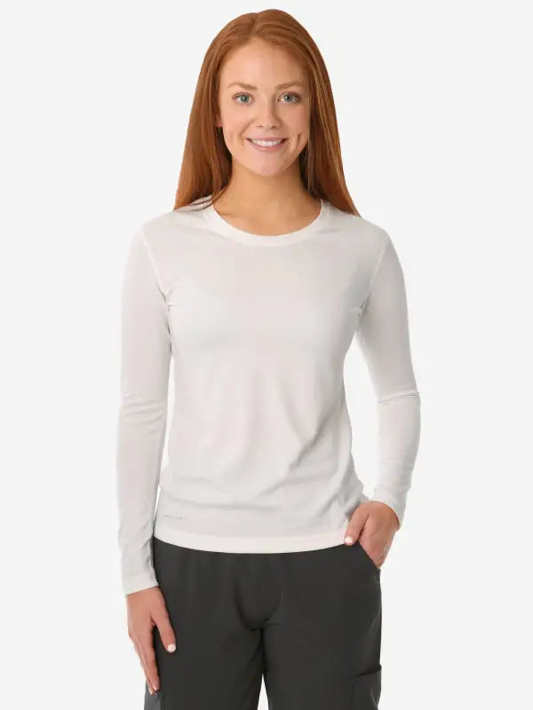 White long-sleeved crewneck top from the Women’s Long-Sleeve Underscrub collection