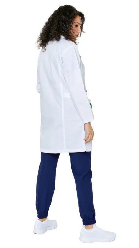 Women’s Multi-Pocket Long Lab Coat worn over navy blue scrubs for medical professionals