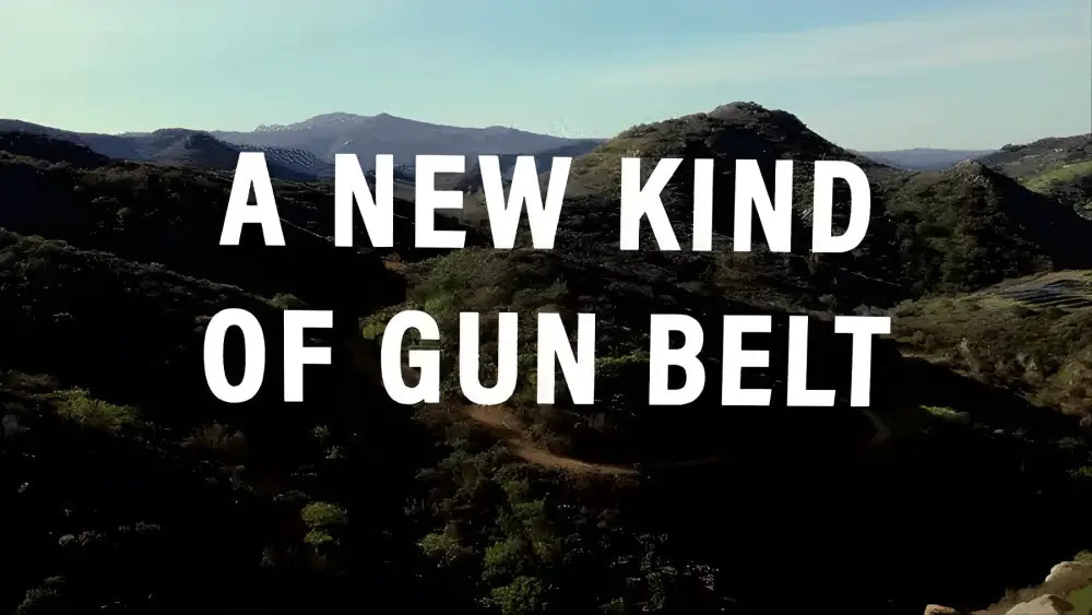 A NEW KIND OF GUN BELT over a mountainous landscape featuring the B1 Black Battle Belt