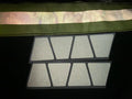 Window with geometric panes in a matte white reflective helmet design