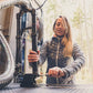 Woman repairing bicycle suspension fork with Gerber Gear 31-003566 Armbar Drive pry bar