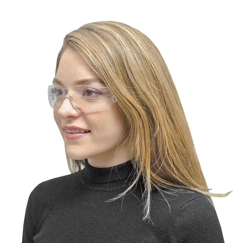 Woman wearing clear safety glasses providing high impact protection and comfortable protection