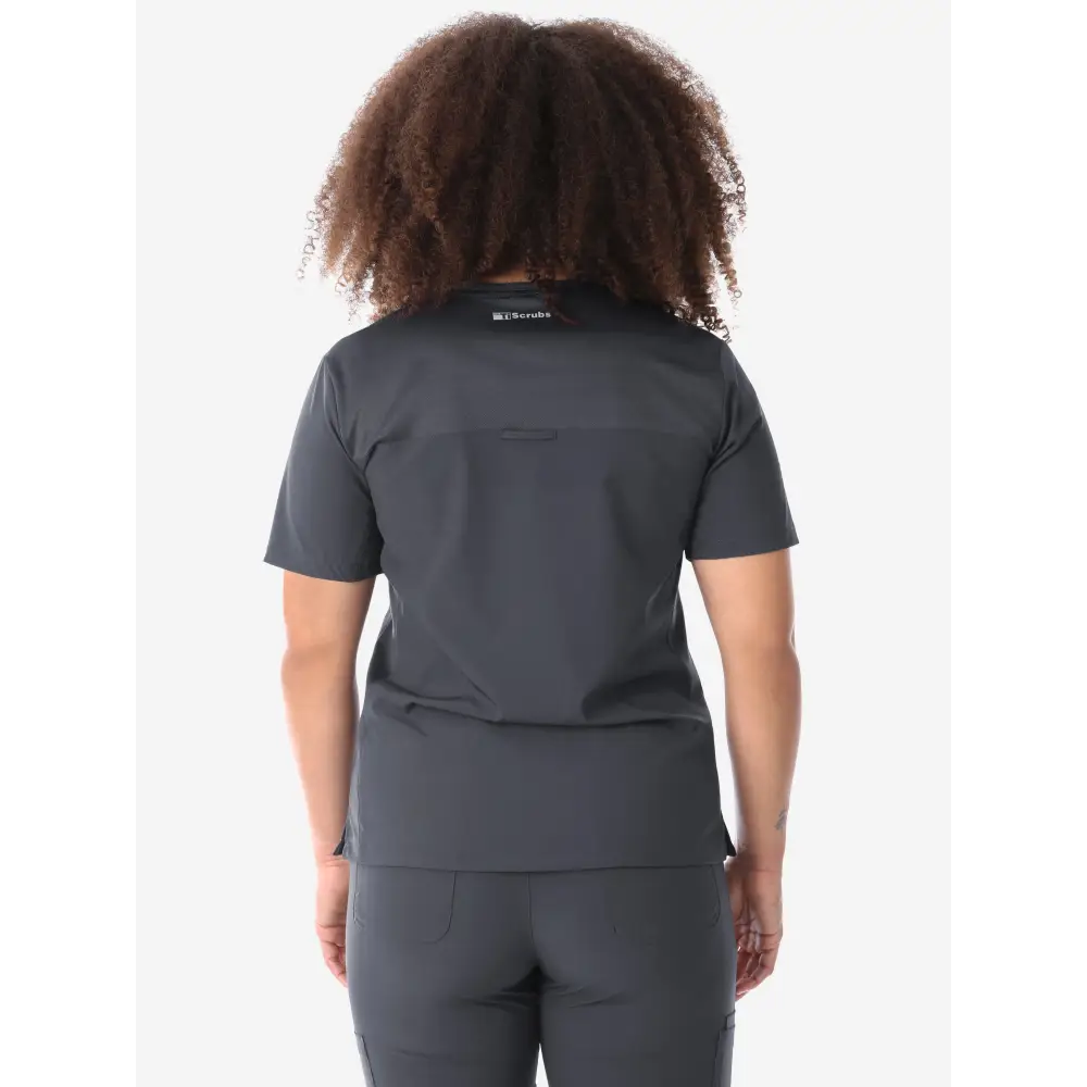 Back view of a dark gray Women’s Four-Pocket Scrub Top with short sleeves