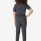 Dark gray women’s four-pocket scrub top with short sleeves and fitted pants