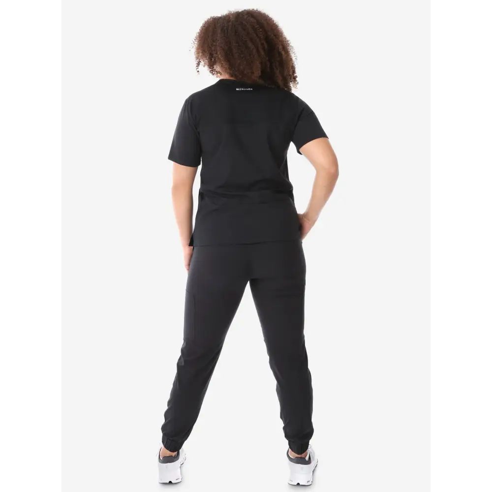 Black cotton jogger jumpsuit with short sleeves and tapered legs for women’s four-pocket scrub