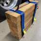 Wooden block secured with blue straps and yellow tags for Cribbing Strap Long-FFCS12