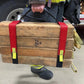 Wooden cribbing blocks with red straps and reflective yellow tabs for cribbing strap short