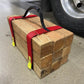 Wooden blocks held together with red straps and yellow hooks for Cribbing Strap Short