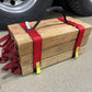 Wooden crate with red straps holding tools showcasing Cribbing Strap Short-FFCS8