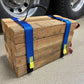 Wooden crate secured with blue ratchet straps using Cribbing Strap Long-FFCS12