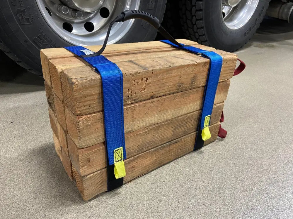 Wooden crate secured with blue ratchet straps using Cribbing Strap Long-FFCS12