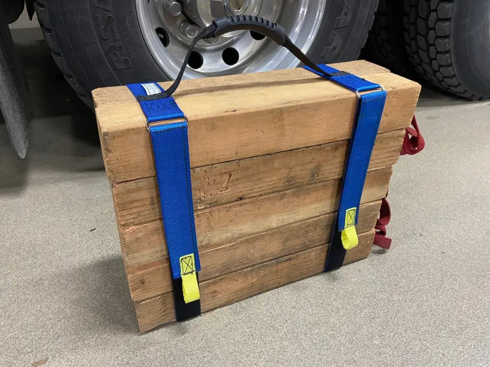 Wooden crate secured with blue cribbing strap Long-FFCS12 and yellow buckles