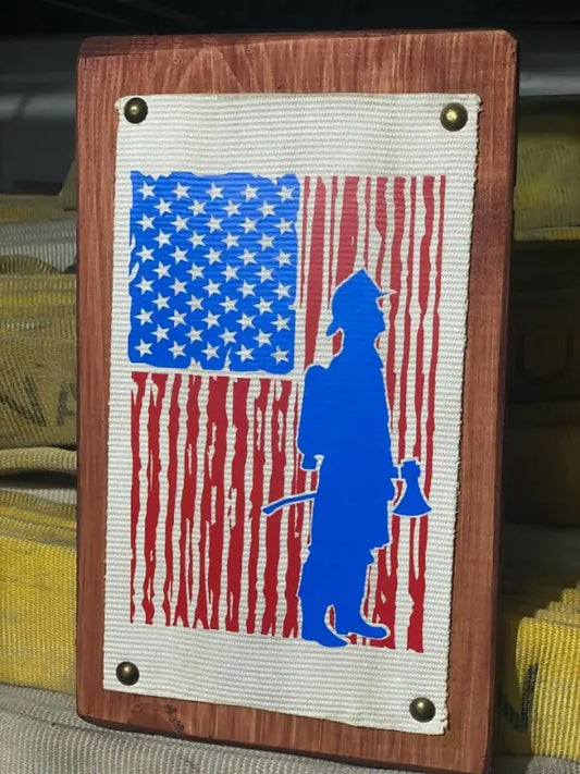 Wooden hose sign featuring American flag and firefighter silhouette for first responders