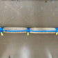 Wooden pole secured with blue straps from 1-3/4 inch Adjustable Hose Bundle Strap Kit