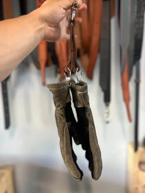 Worn brown leather work gloves for first responders and firefighters with quick release GLOVE STRAP DUAL CLIP NO.2