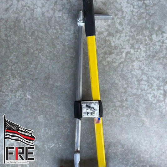 Yellow and black Halligan tool with silver ends on Irons Marrying Strap with Hypalon backing