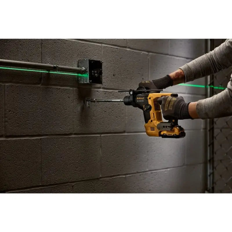 Yellow cordless DEWALT DCH072B XTREME 12V MAX Brushless Rotary Hammer in use with gloves