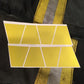 Yellow geometric panels with white lines on Yellow Reflective Helmet Tetrahedron 8 Pack