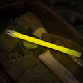 Glowing yellow M-Tac Glow Sticks 6’’ showcasing a vibrant light stick set