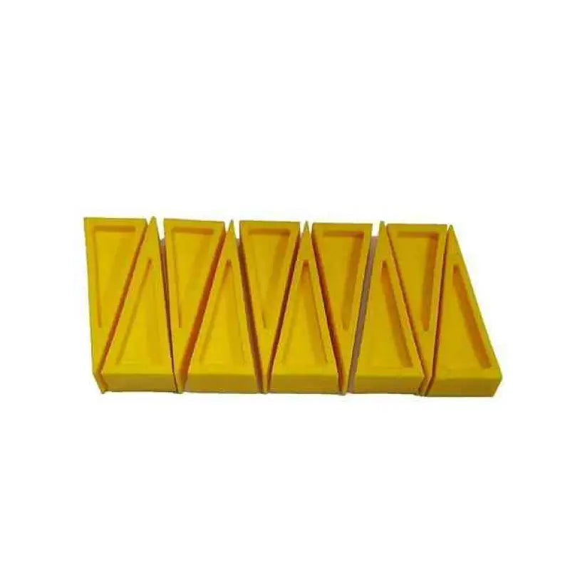 Yellow plastic tray with five triangular compartments for Firefighter Door Stopper safety wedges