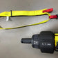 Yellow extrication tool carrying strap with black and red buckles for secure use