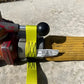 Yellow strap securing black knob in Gated Wye Strap - FFGWS for interior firefighters