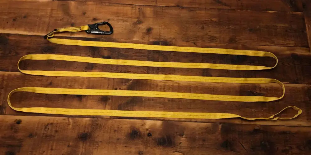 Yellow tow strap with black carabiner for personal carry and fireground applications