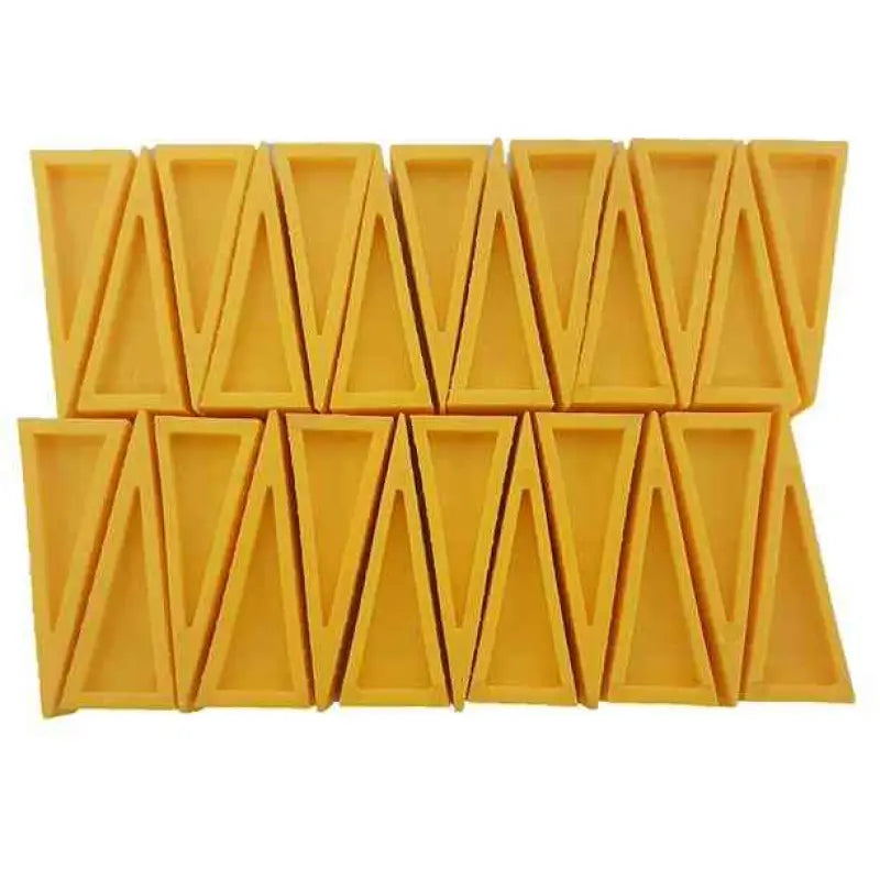 Yellow triangular chocolate bar segments resembling Firefighter Door Stopper safety wedges